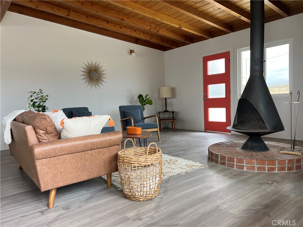 52024 Nehlsen Road Johnson Valley, CA 92285 - Photo 4 of 8 a living room with furniture and a wooden floor