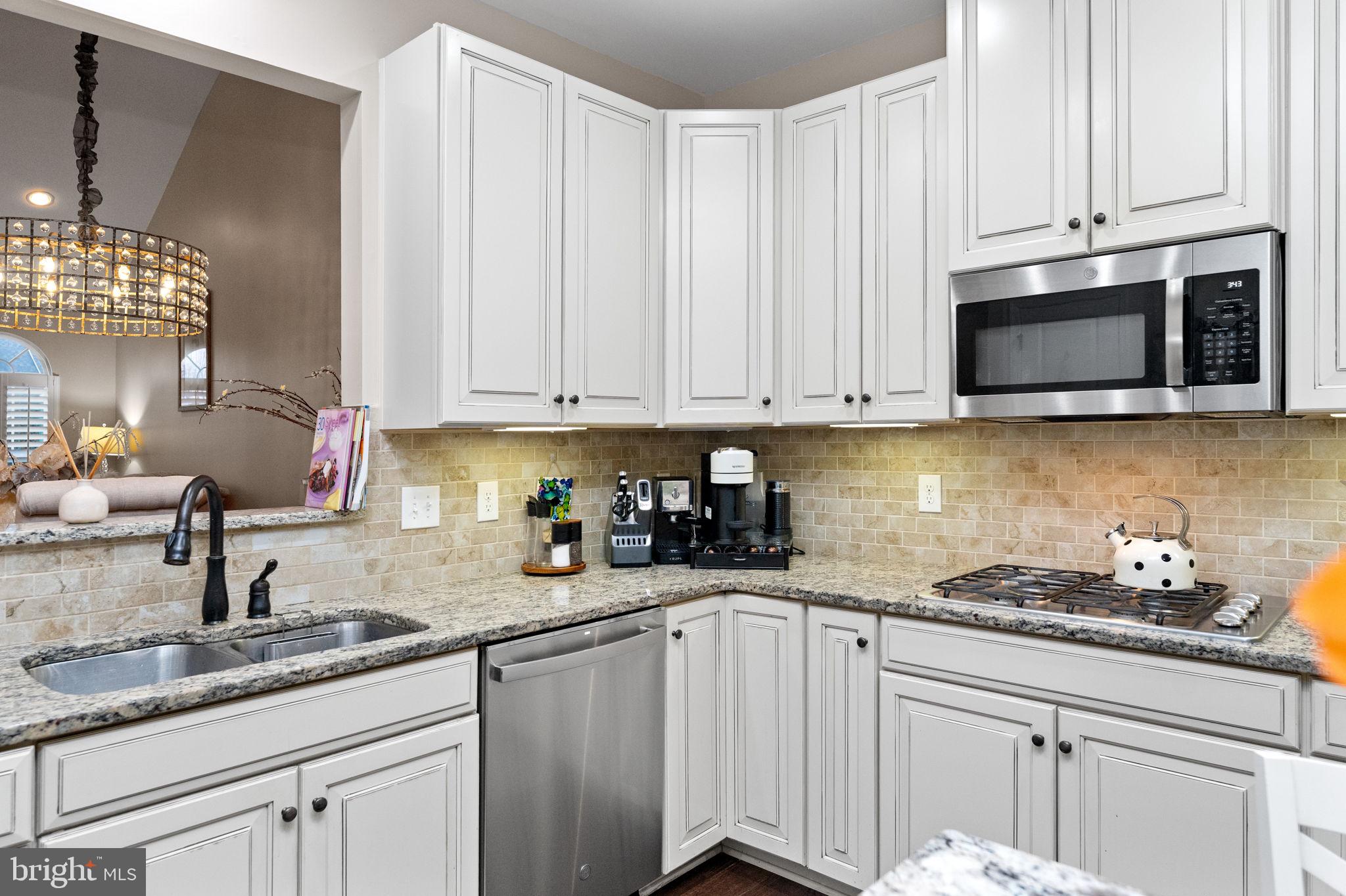 870 Reynards Run Blue Bell, PA 19422 - Photo 11 of 30 a kitchen with stainless steel appliances granite countertop white cabinets a sink and dishwasher
