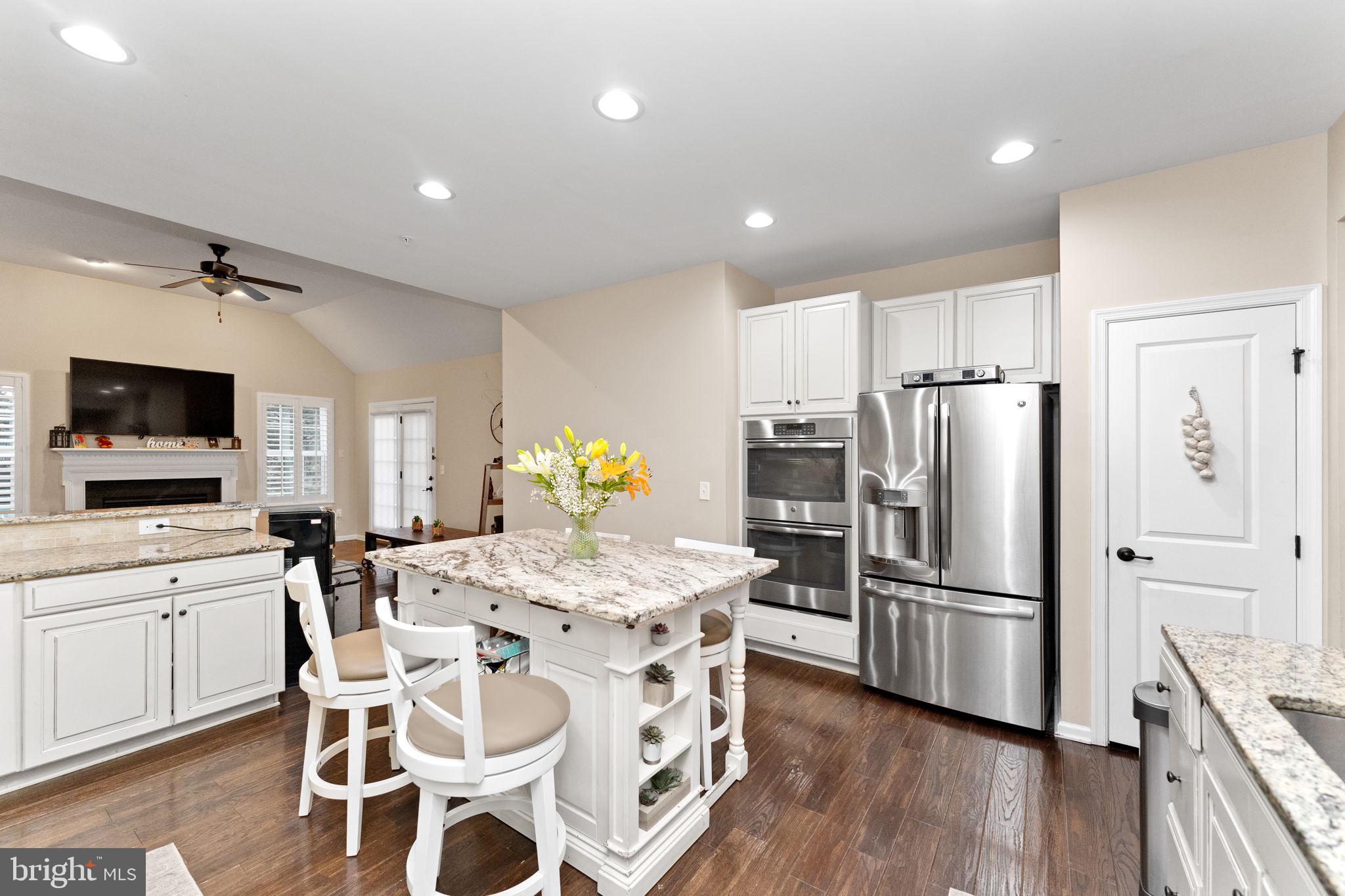 870 Reynards Run Blue Bell, PA 19422 - Photo 12 of 30 a kitchen with stainless steel appliances a dining table chairs and refrigerator