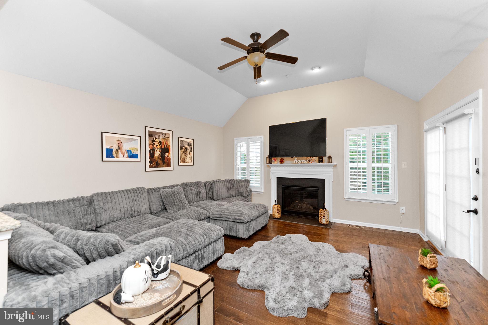 870 Reynards Run Blue Bell, PA 19422 - Photo 13 of 30 a living room with furniture a fireplace and a flat screen tv