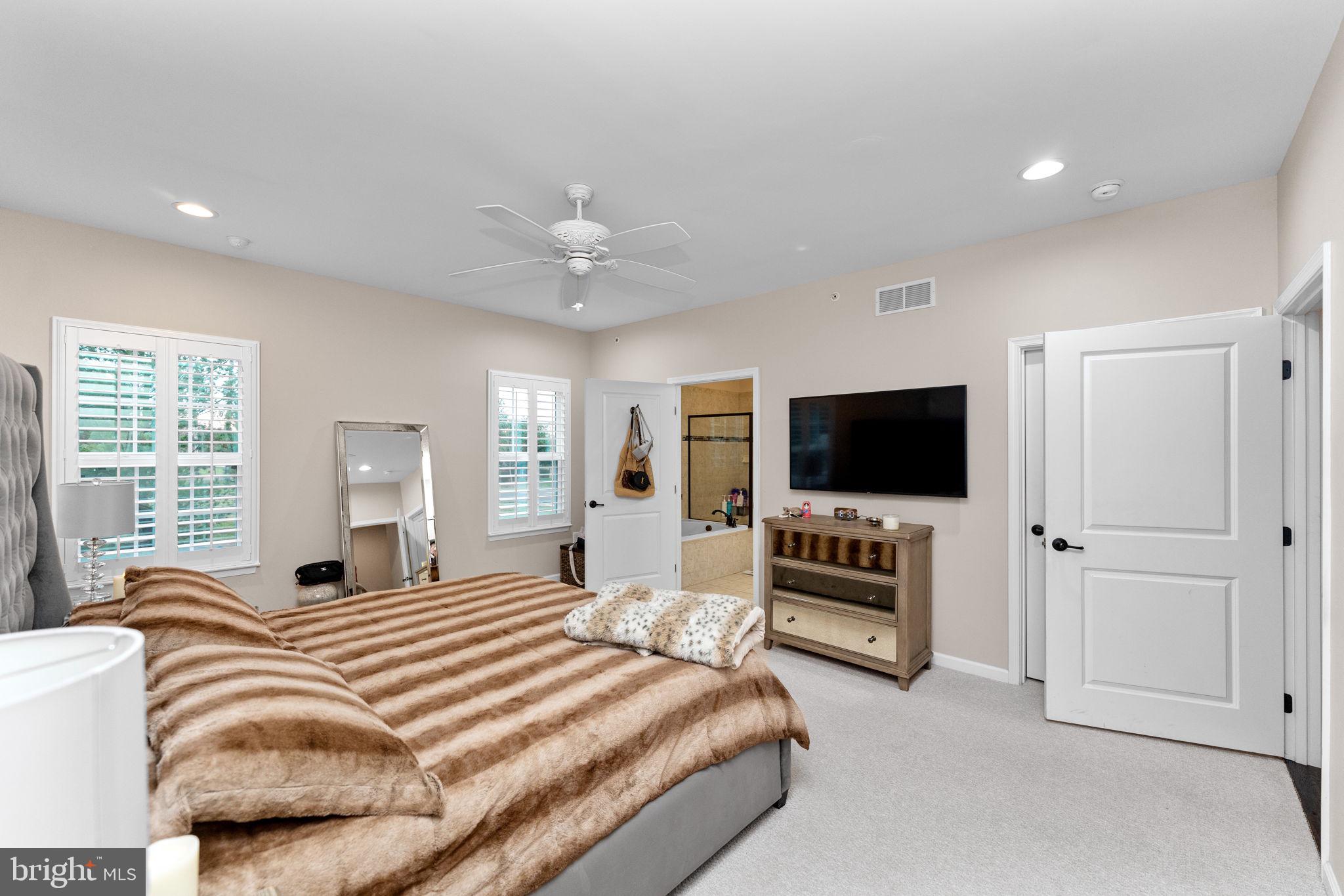 870 Reynards Run Blue Bell, PA 19422 - Photo 16 of 30 a bedroom with a bed and a flat screen tv