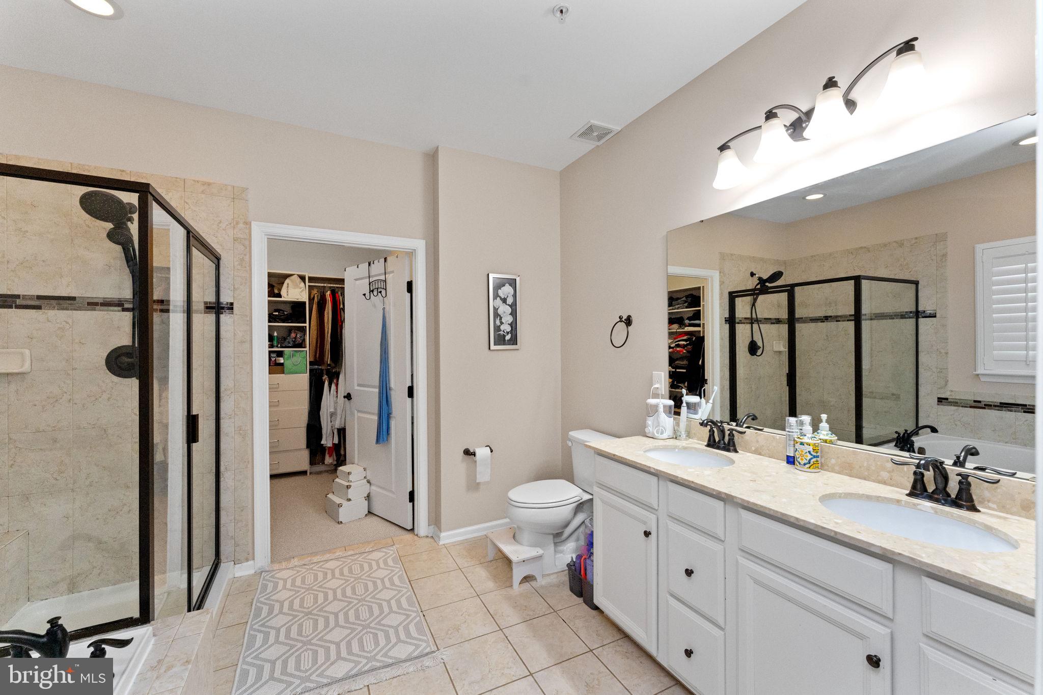 870 Reynards Run Blue Bell, PA 19422 - Photo 17 of 30 a bathroom with a double vanity sink toilet mirror and bathtub