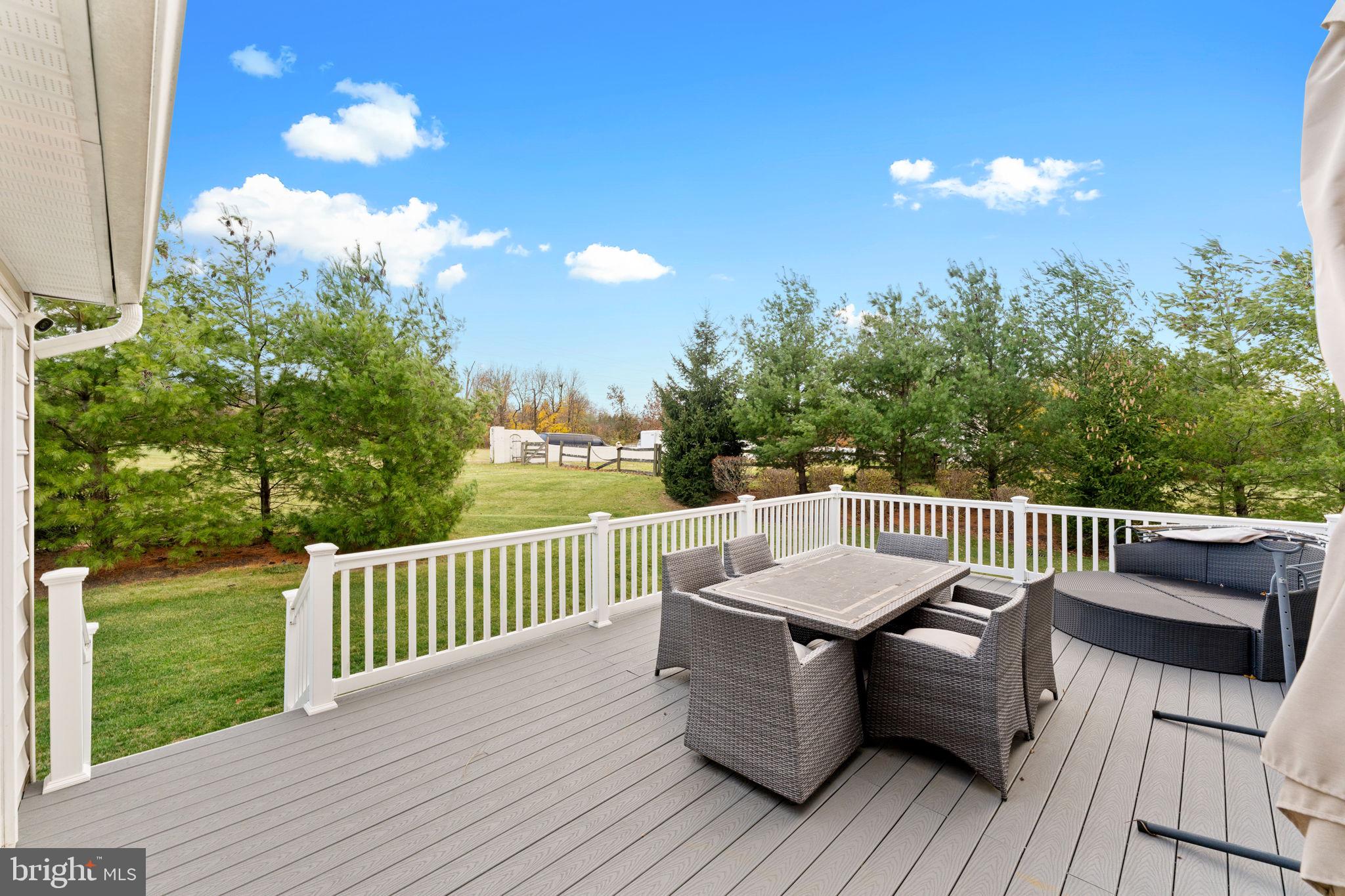870 Reynards Run Blue Bell, PA 19422 - Photo 29 of 30 a view of a patio on wooden deck and a backyard