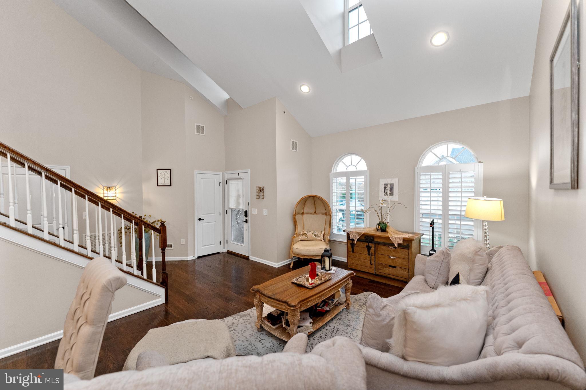 870 Reynards Run Blue Bell, PA 19422 - Photo 4 of 30 a living room with furniture stairs and a chandelier