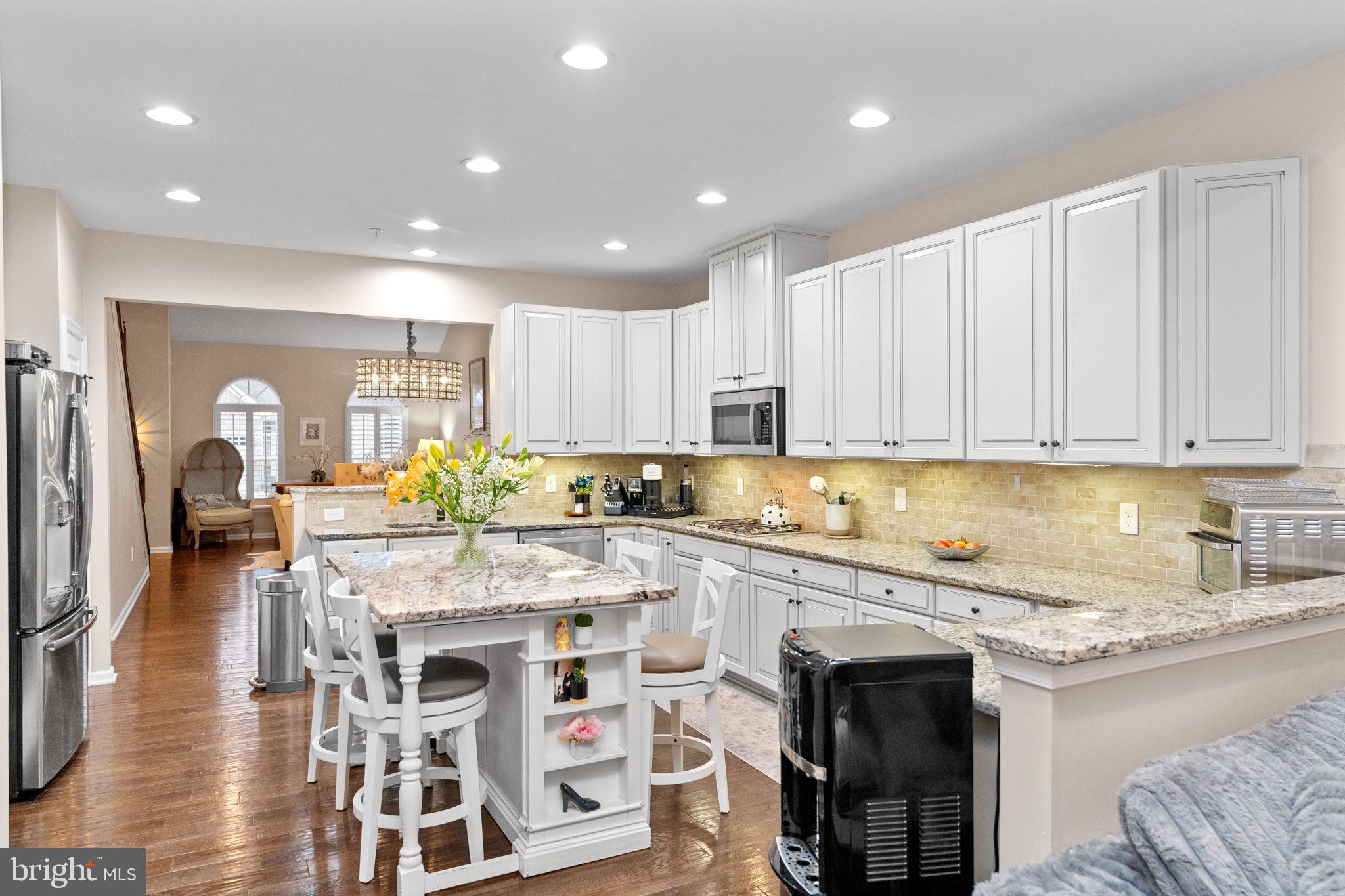 870 Reynards Run Blue Bell, PA 19422 - Photo 10 of 30 a kitchen with stainless steel appliances granite countertop a table chairs sink and cabinets