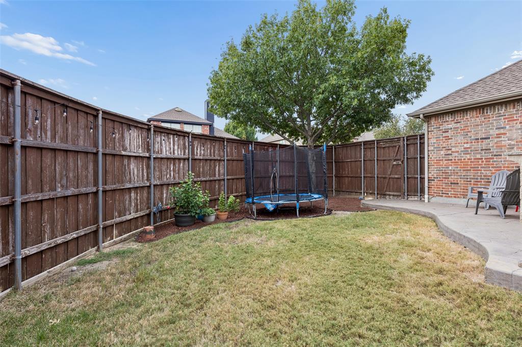 2865 Ridge View Road Frisco, TX 75034 - Photo 38 of 38 Private backyard featuring a concrete patio, wood privacy fencing, and a mature tree