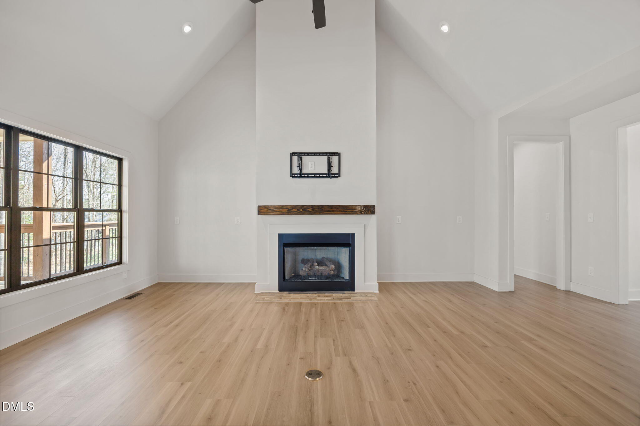 6450 Moores Mill Road Rougemont, NC 27572 - Photo 15 of 66 wooden floor fireplace and windows in an empty room