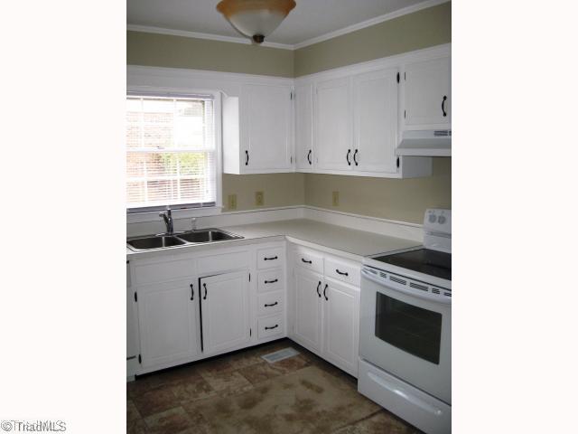 1908 Three Meadows Road Greensboro, NC 27455 - Photo 2 of 15 Kitchen. The kitchen cabinets have new pulls on them and have just been painted. The stove and range hood are also new.