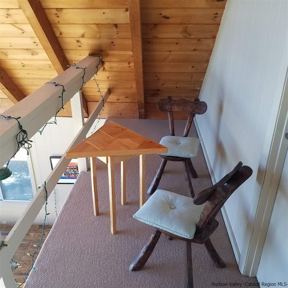 178 Upper Highland Circle Roxbury, NY 12421 - Photo 11 of 35 a balcony with table and chairs