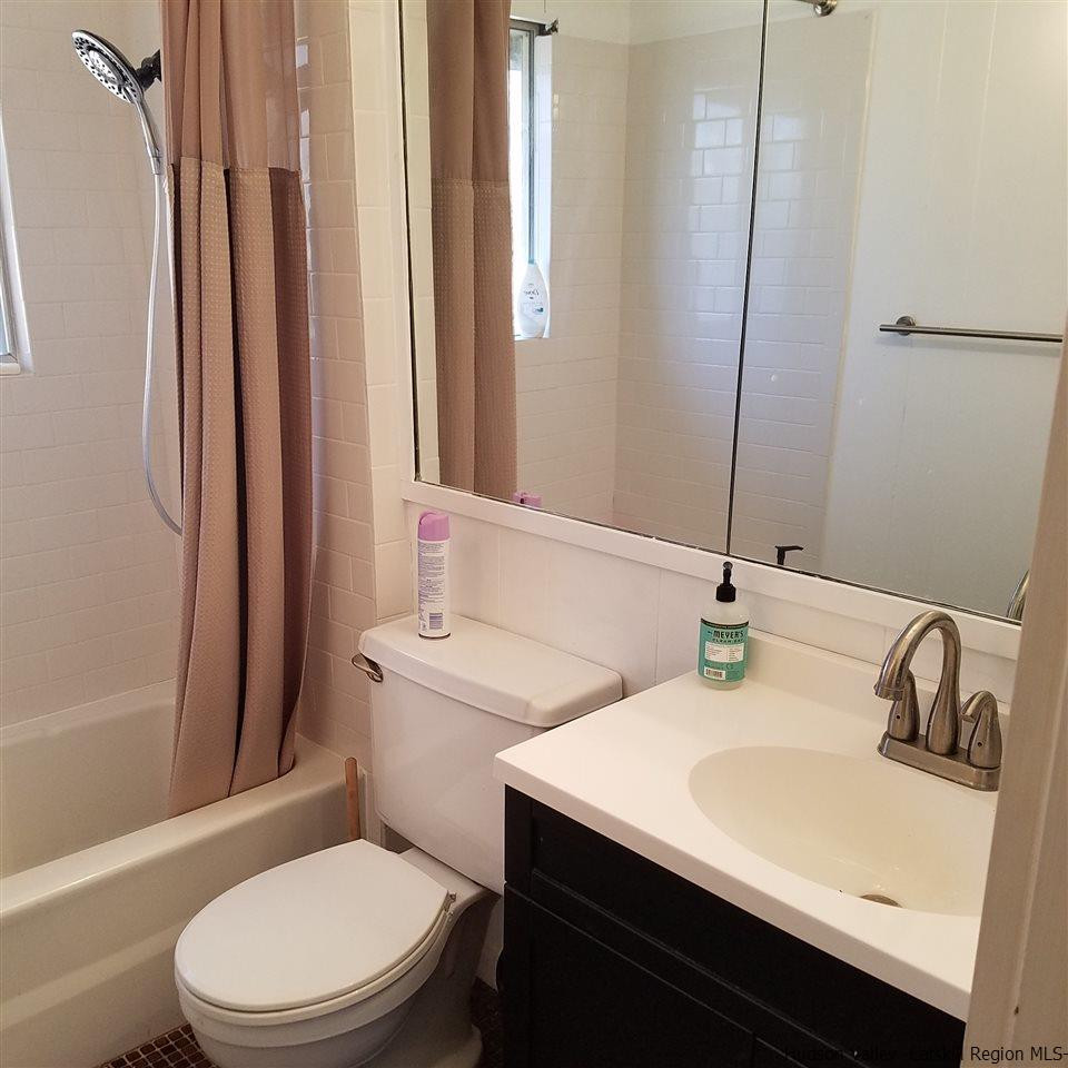178 Upper Highland Circle Roxbury, NY 12421 - Photo 10 of 35 a bathroom with a sink toilet and mirror