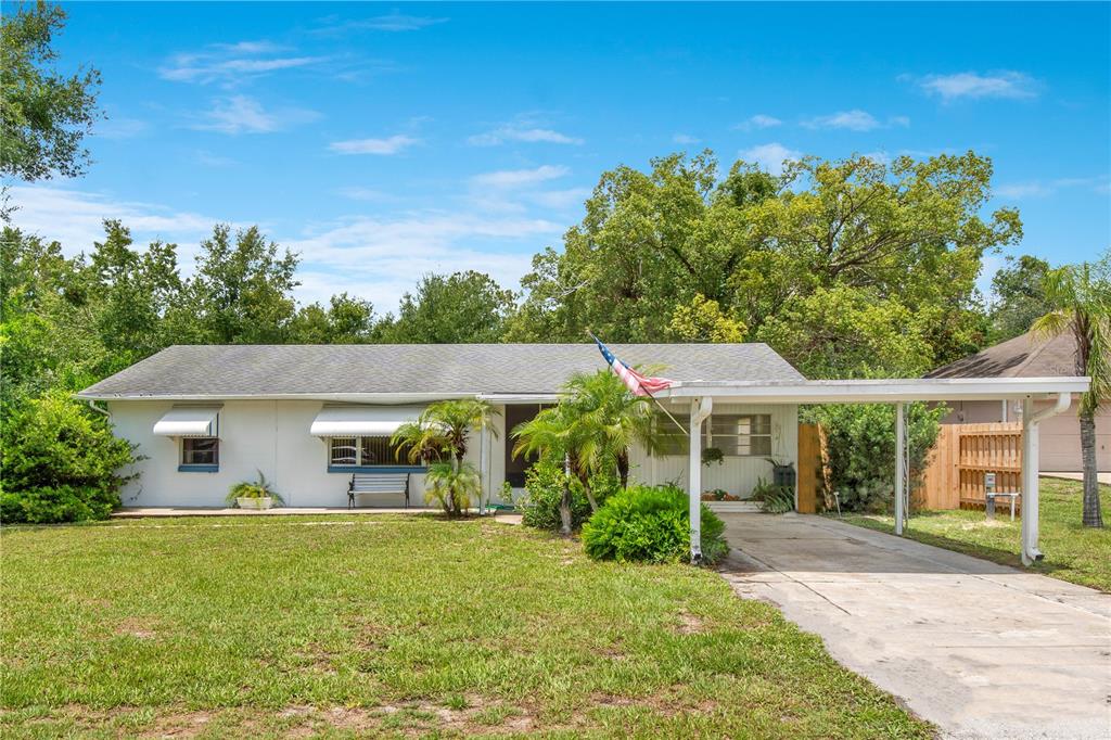 110 Amigos Road DeBary, FL 32713 - Photo 1 of 1 front view of a house with a yard