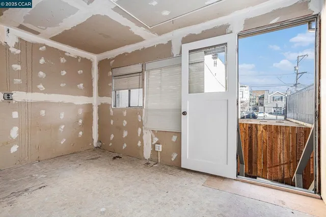 a view of a hallway with a bathroom