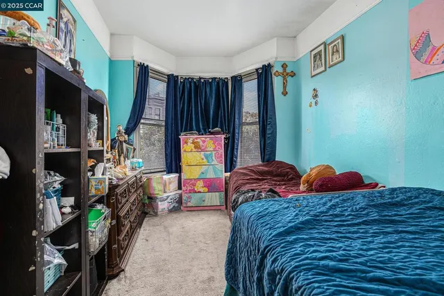 a bedroom with a bed and dresser