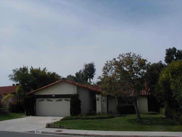 312 Trailview Road Encinitas, CA 92024 - Photo 1 of 1 a front view of a house with a garden and trees