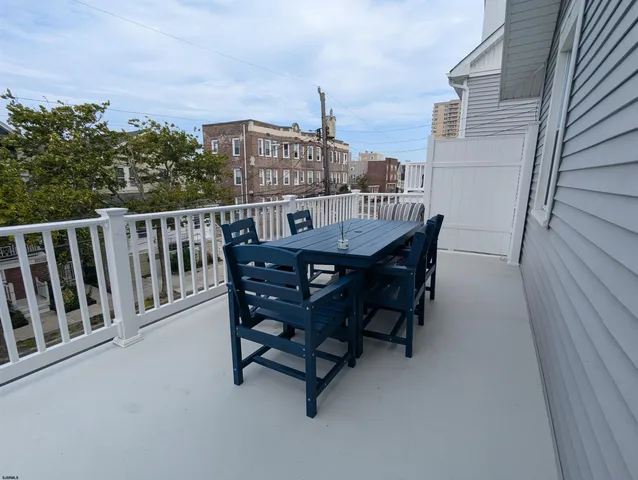 a view of balcony with furniture