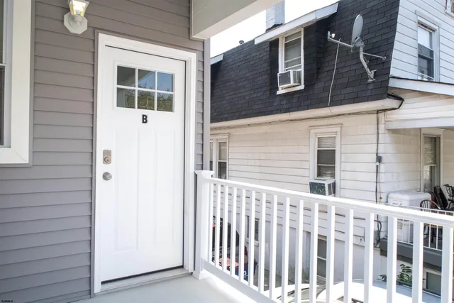 a front view of a house with a porch