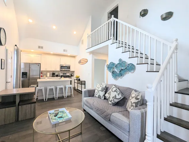 a living room with furniture and a table