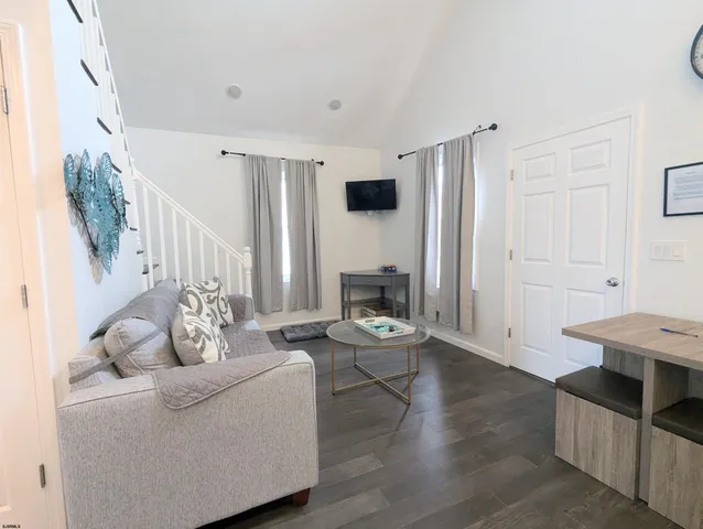 a living room with furniture and a table