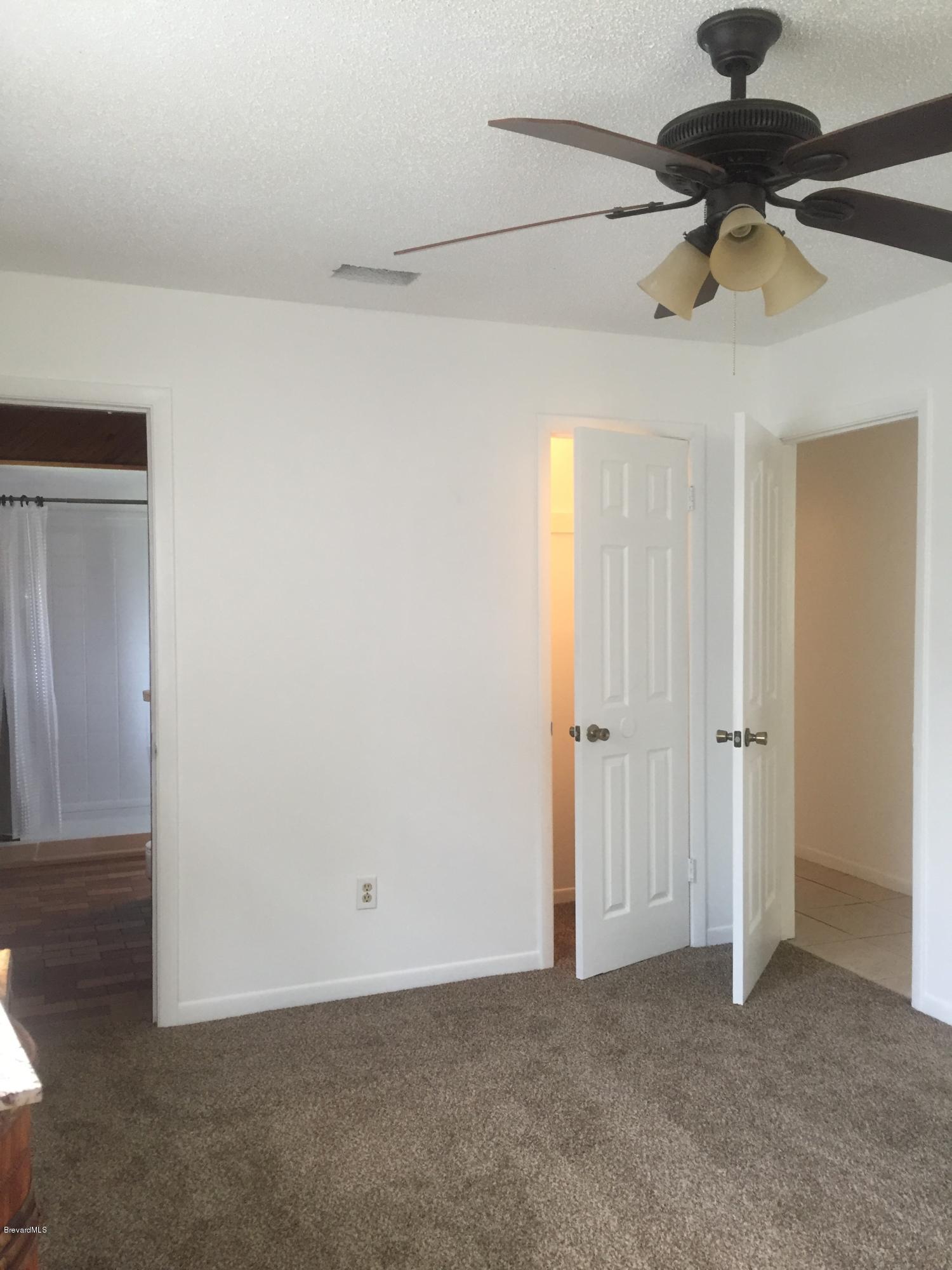 5448 Flint Road Cocoa, FL 32927 - Photo 18 of 35 Master Bed to Bath/Hall Way