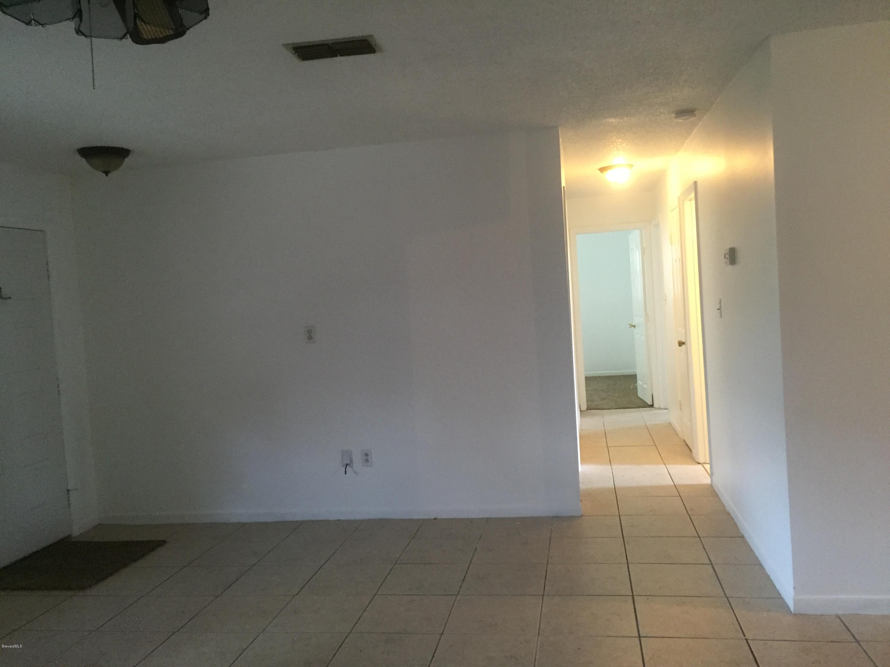 5448 Flint Road Cocoa, FL 32927 - Photo 8 of 35 Living Room to Hall Way