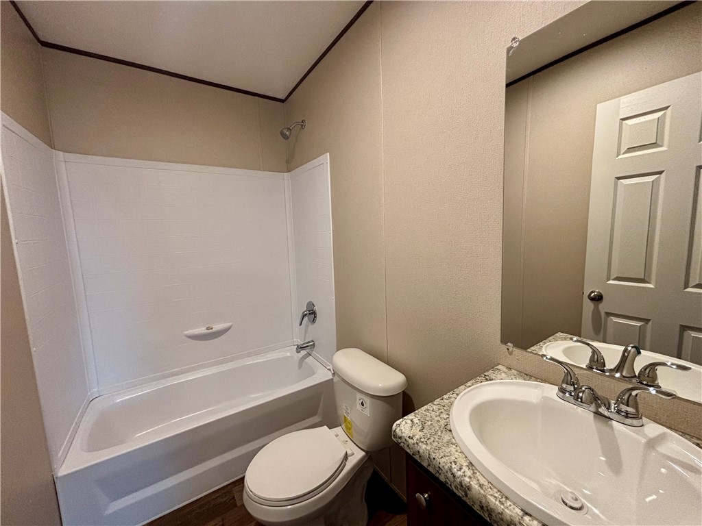 703 Double Springs Road Townville, SC 29689 - Photo 12 of 22 This bathroom features a sleek vanity with a spacious basin, ideal for everyday routines.
