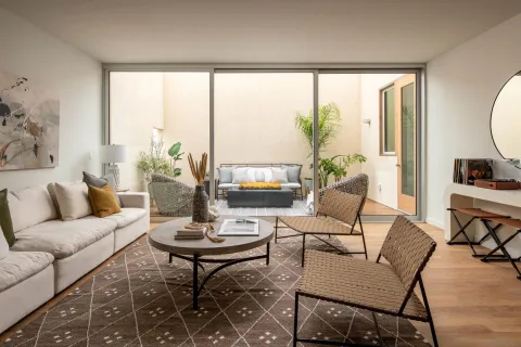 a living room with furniture and a large window