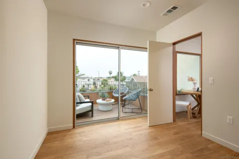 a view of a room with a large window and chair