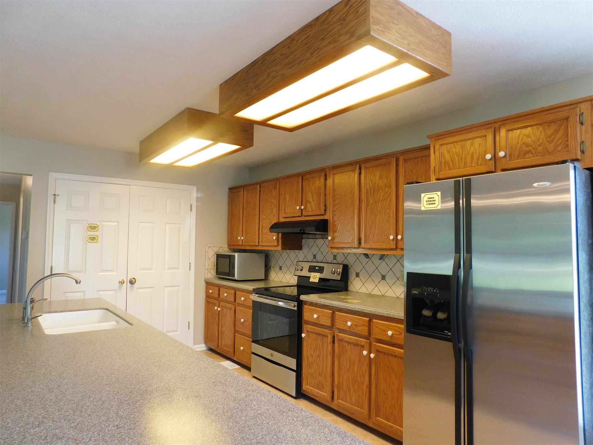 2470 Ben Green Road Lebanon, TN 37090 - Photo 11 of 24 a kitchen with granite countertop a refrigerator and a sink