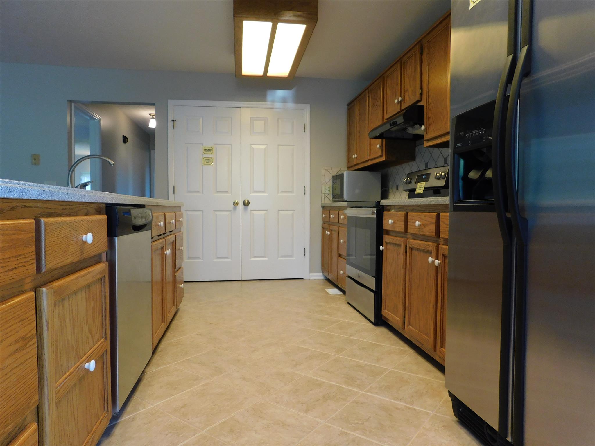 2470 Ben Green Road Lebanon, TN 37090 - Photo 12 of 24 a kitchen with stainless steel appliances granite countertop a refrigerator and a sink