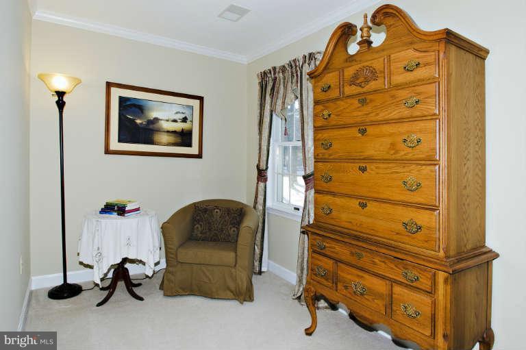 7025 Deer Valley Road Highland, MD 20777 - Photo 14 of 30 a bedroom with a bed and a dresser
