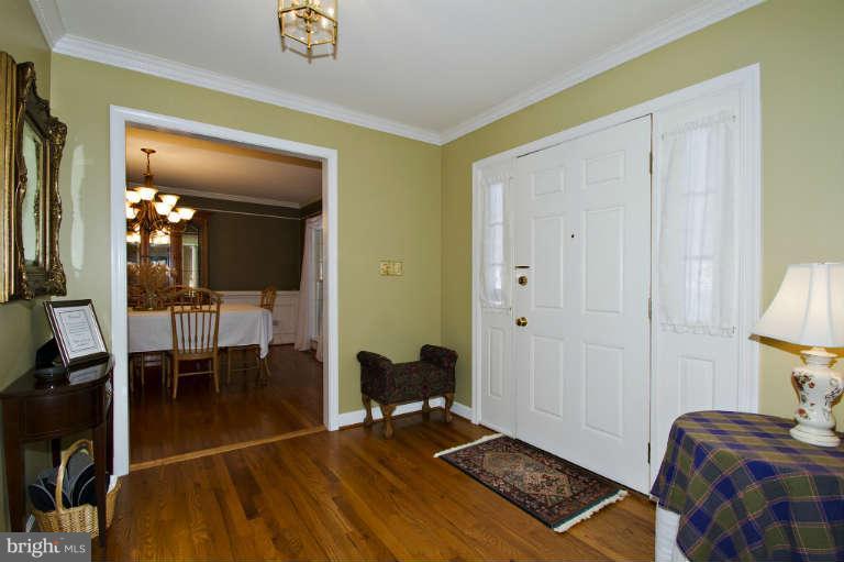 7025 Deer Valley Road Highland, MD 20777 - Photo 3 of 30 a bedroom with furniture and a lamp