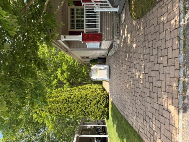 1661 Old Country Road, Unit 516 Riverhead, NY 11901 - Photo 2 of 50 a front view of a house with a yard