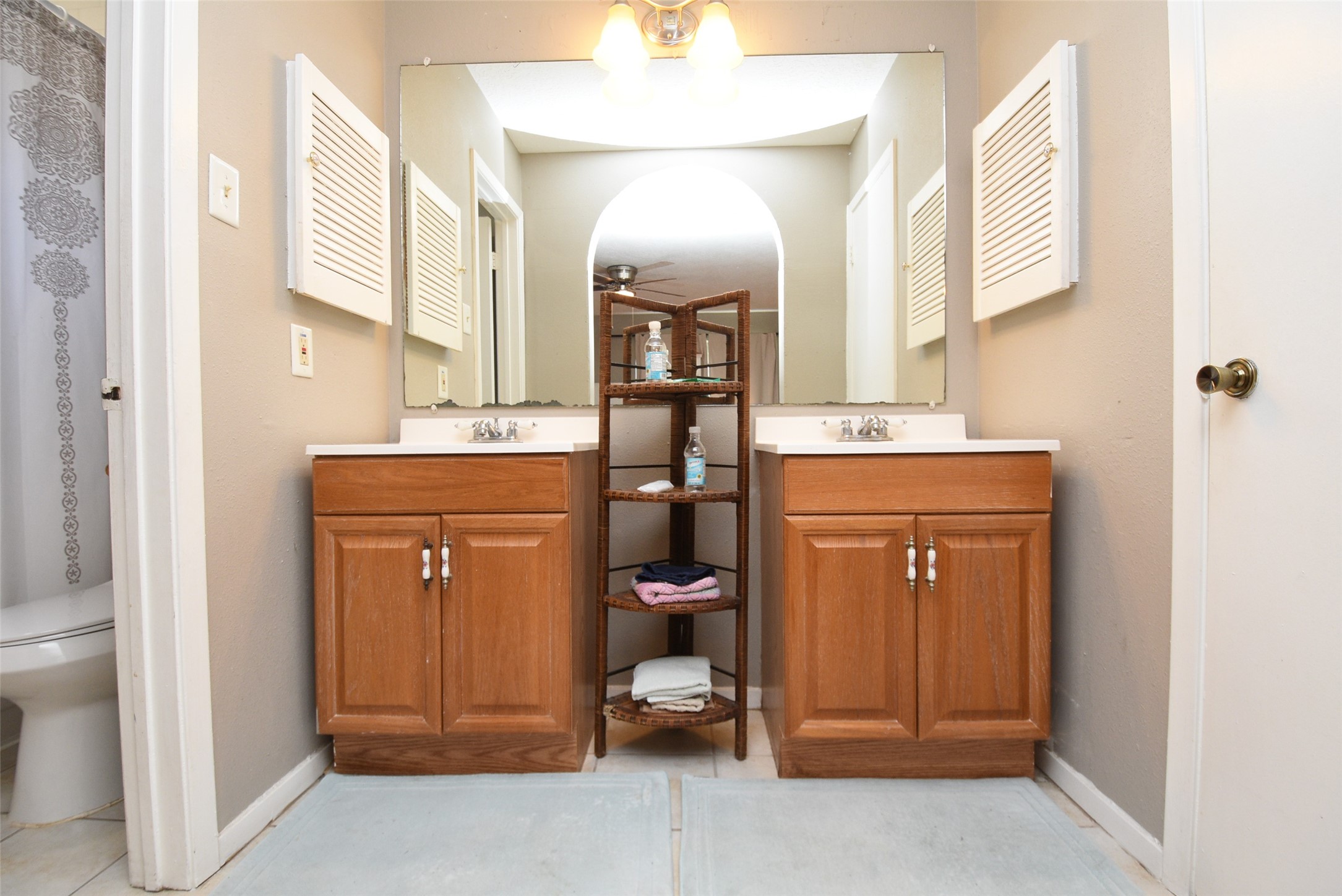 20003 Bolton Bridge Lane Humble, TX 77338 - Photo 5 of 33 a room with a sink and a mirror