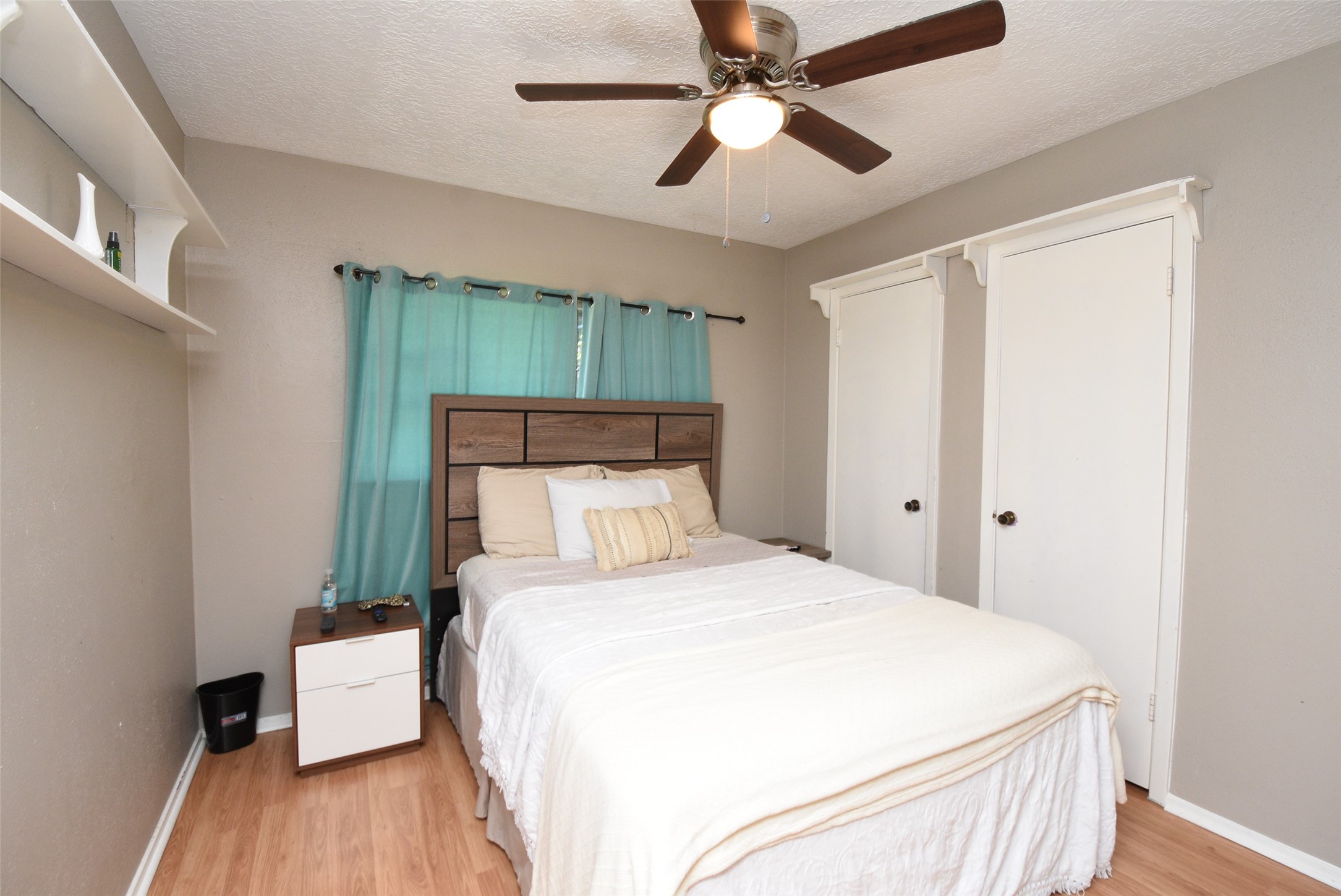 20003 Bolton Bridge Lane Humble, TX 77338 - Photo 10 of 33 a bedroom with a bed and a chandelier