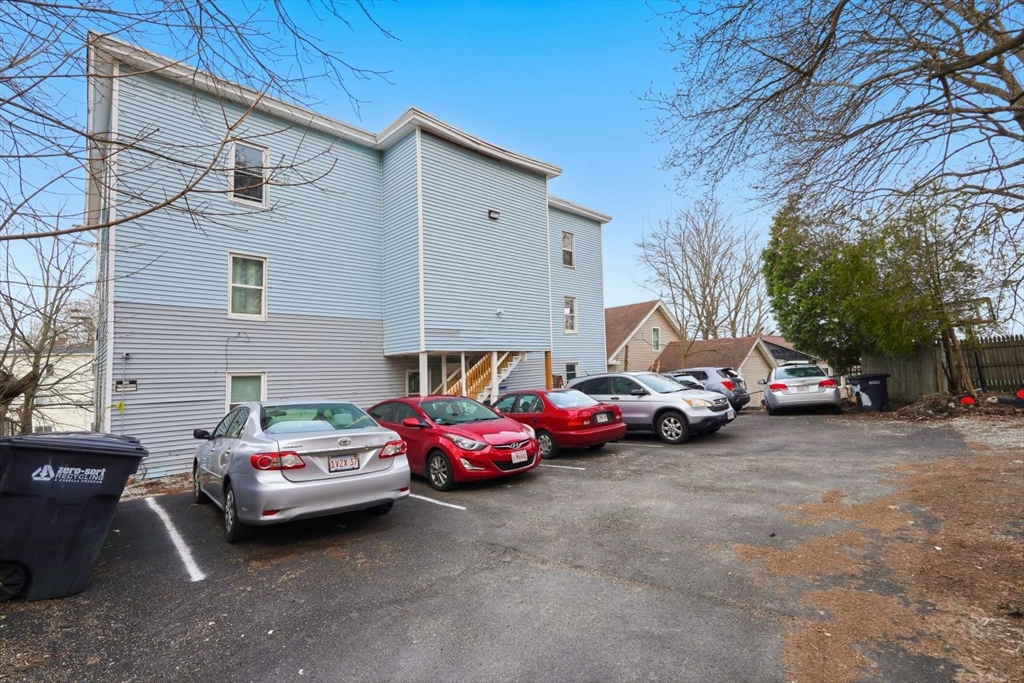 573 Main Street Southbridge, MA 01550 - Photo 11 of 15 a car parked in front of a house
