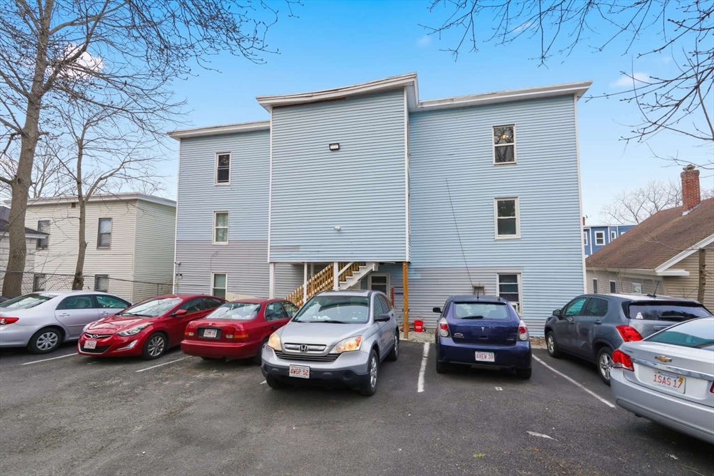 573 Main Street Southbridge, MA 01550 - Photo 12 of 15 a couple of cars parked in front of a house