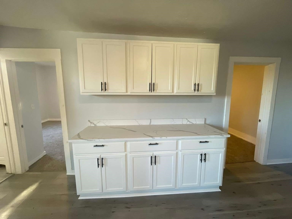 573 Main Street Southbridge, MA 01550 - Photo 6 of 15 a view of cabinets with wooden floor