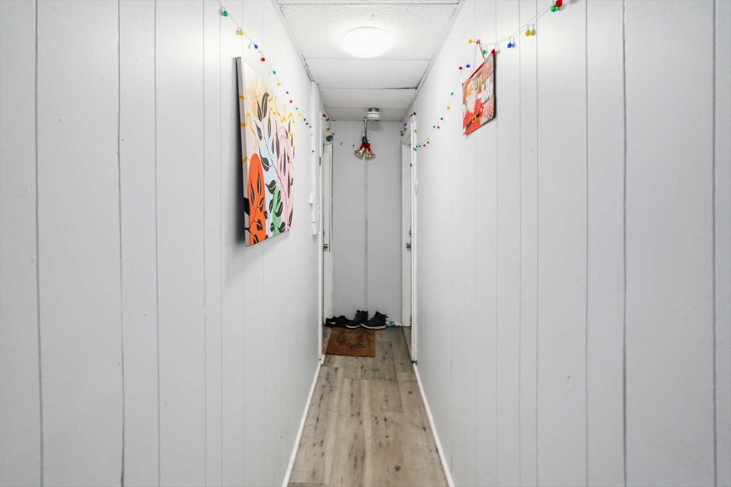 573 Main Street Southbridge, MA 01550 - Photo 10 of 15 a view of a hallway with wooden floor and entryway