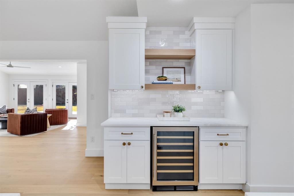 7124 Meadow Road Dallas, TX 75230 - Photo 18 of 39 a living room with furniture and a fireplace