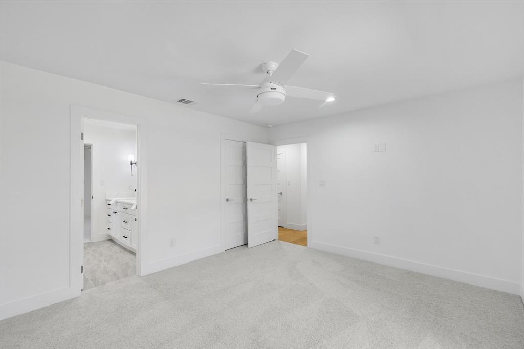 7124 Meadow Road Dallas, TX 75230 - Photo 24 of 39 wooden floor in an empty room