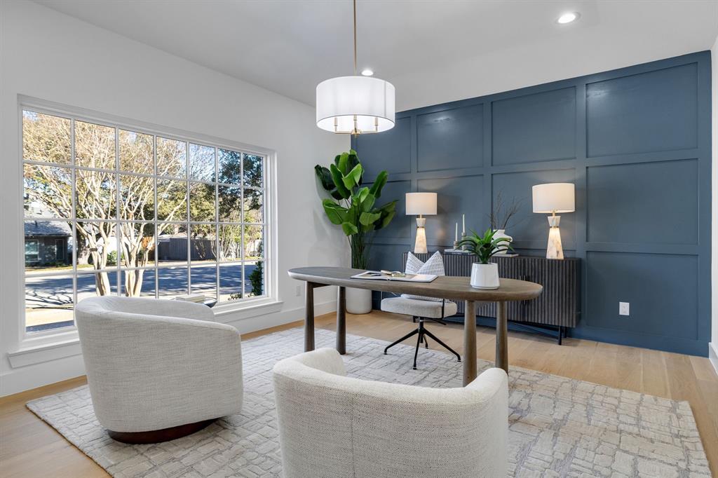 7124 Meadow Road Dallas, TX 75230 - Photo 7 of 39 a living room with couches a table and a potted plant