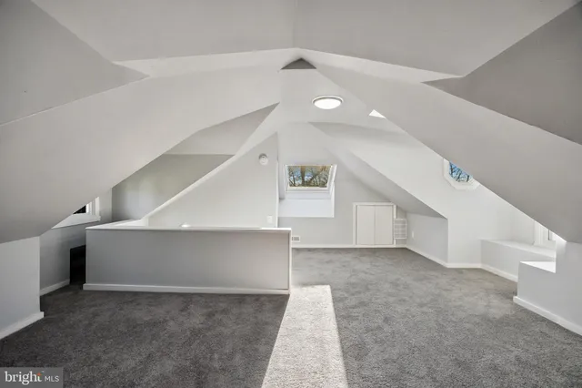 a view of an empty room with windows