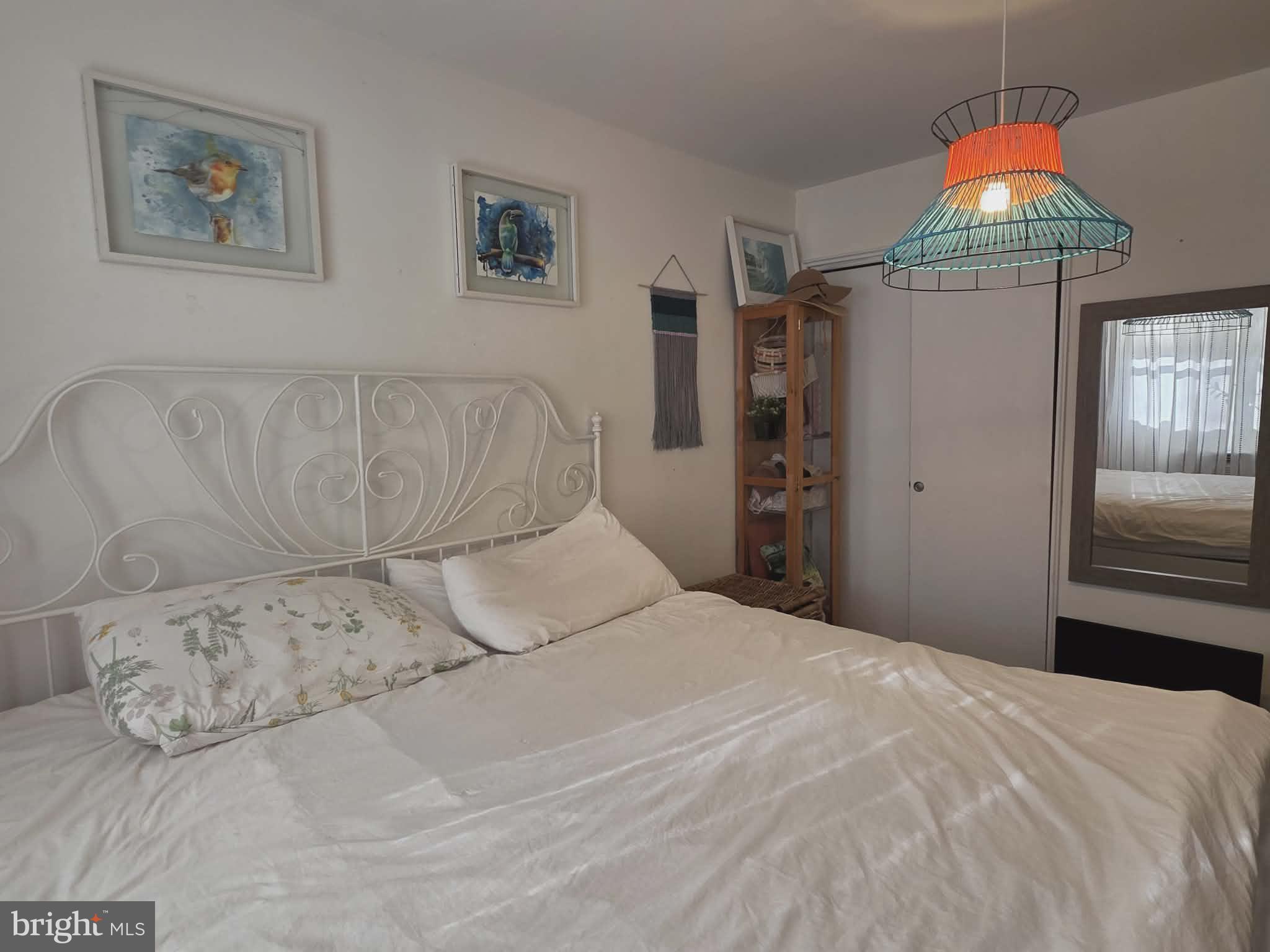 412 North Wayne Avenue, Unit 109 Wayne, PA 19087 - Photo 11 of 20 a bedroom with a bed and a window