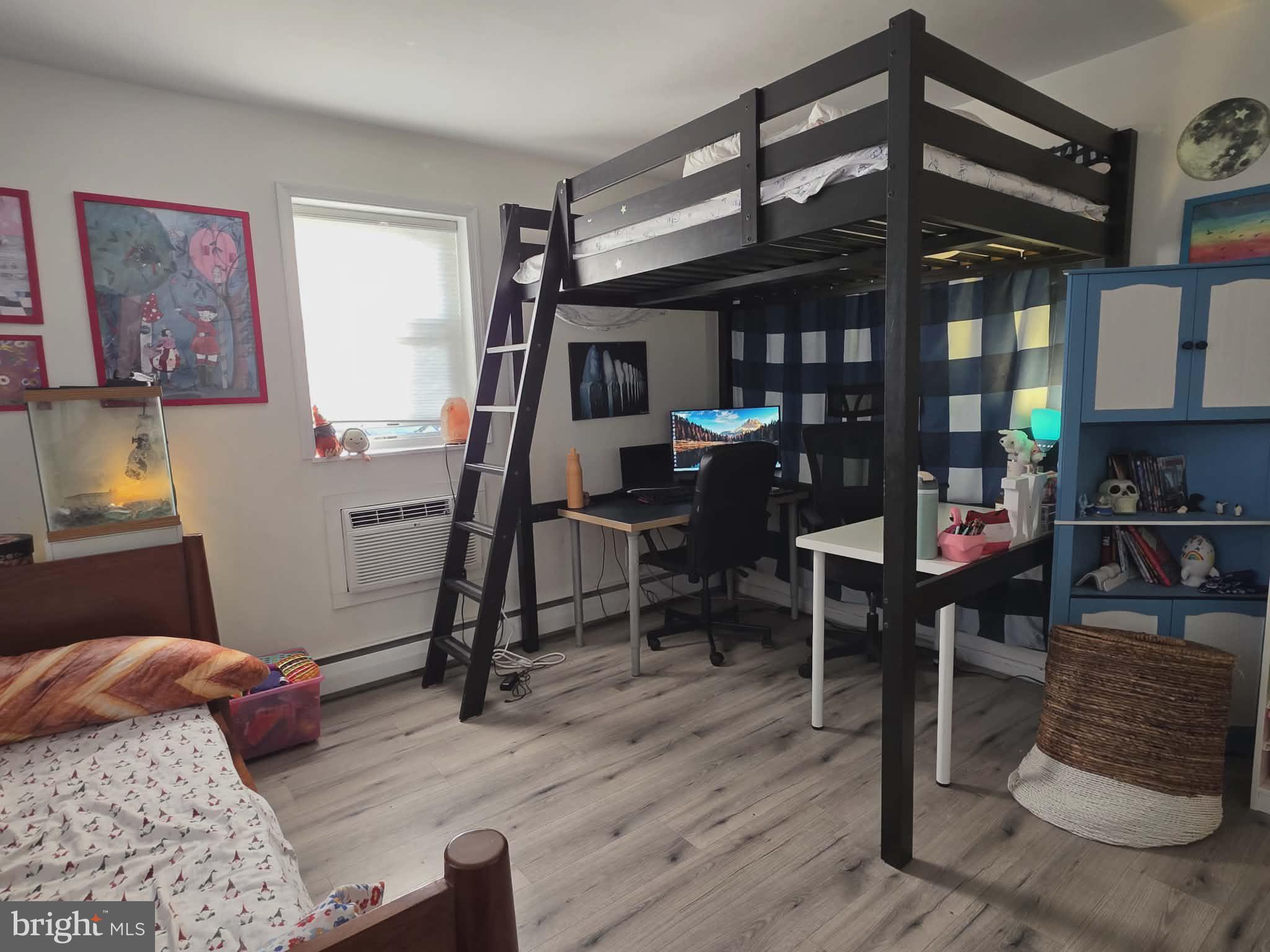 412 North Wayne Avenue, Unit 109 Wayne, PA 19087 - Photo 14 of 20 a bedroom with furniture and a window