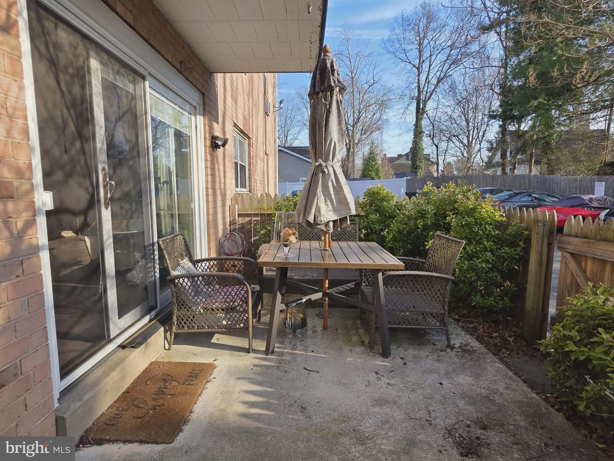 412 North Wayne Avenue, Unit 109 Wayne, PA 19087 - Photo 16 of 20 a view of a patio with table and chairs and potted plants