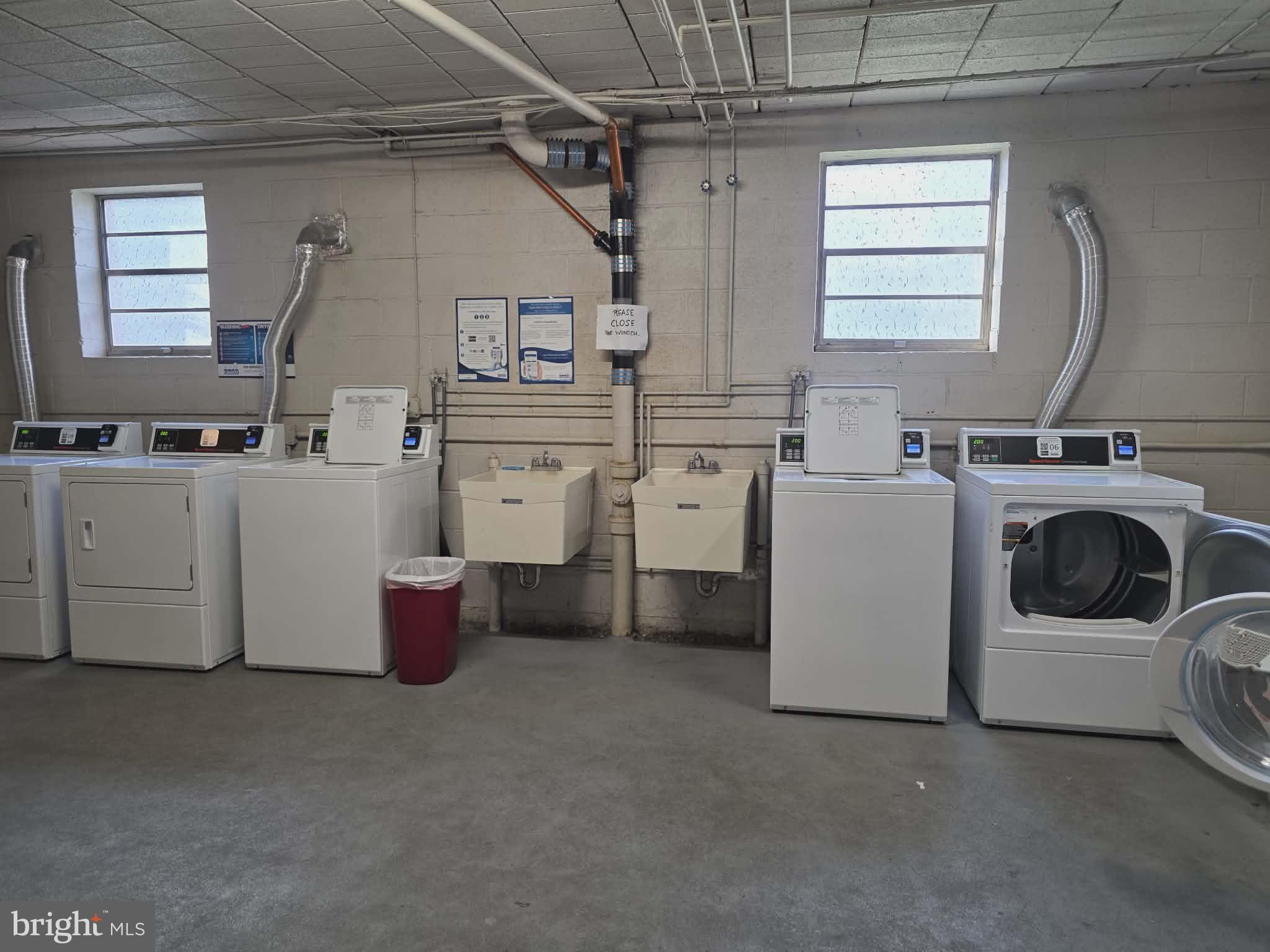 412 North Wayne Avenue, Unit 109 Wayne, PA 19087 - Photo 18 of 20 a utility room with dryer and washer