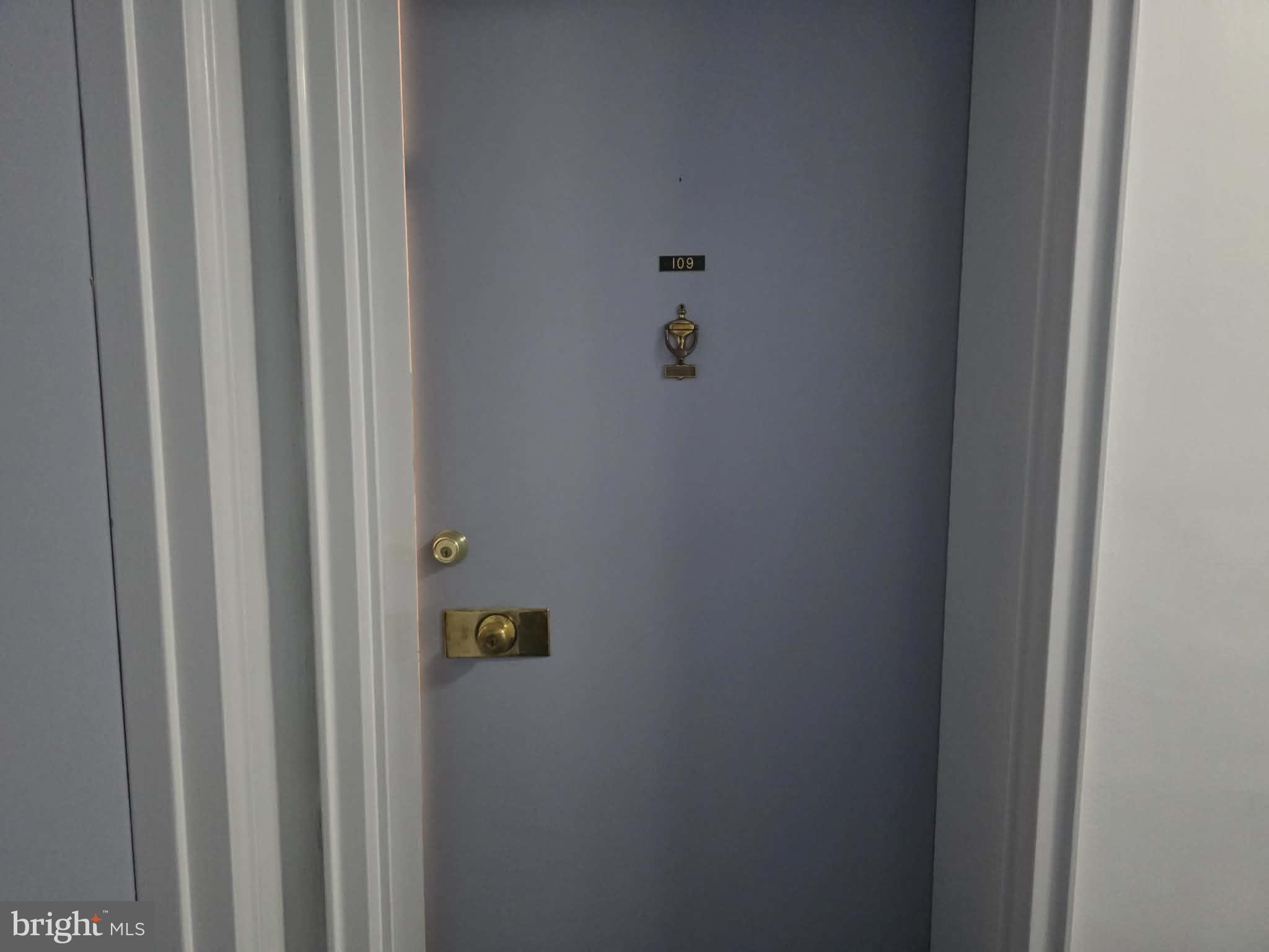 412 North Wayne Avenue, Unit 109 Wayne, PA 19087 - Photo 2 of 20 a bathroom with a shower curtain