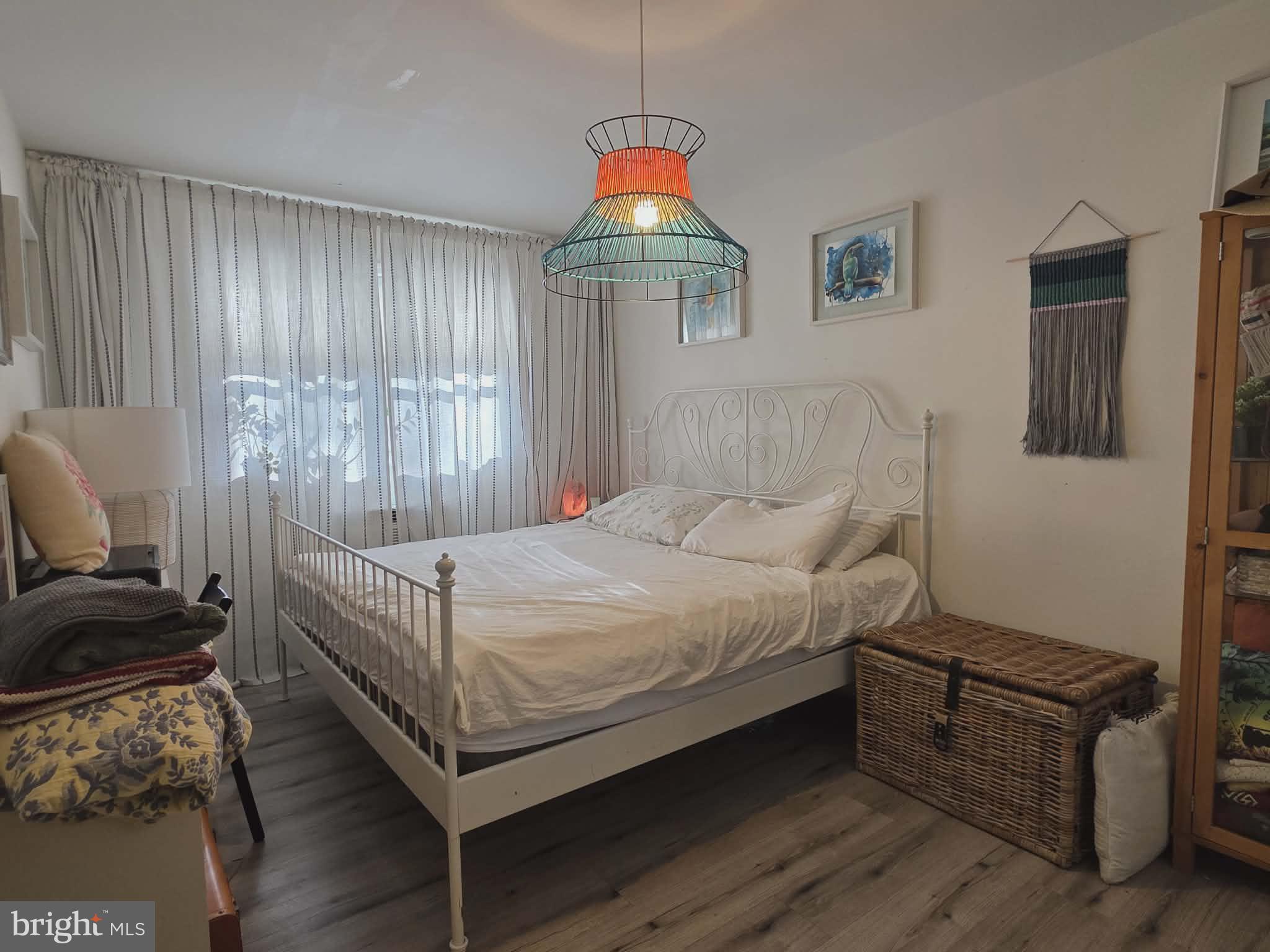 412 North Wayne Avenue, Unit 109 Wayne, PA 19087 - Photo 10 of 20 a bedroom with a bed and a window