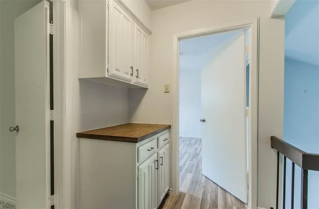 a view of a kitchen from the hallway