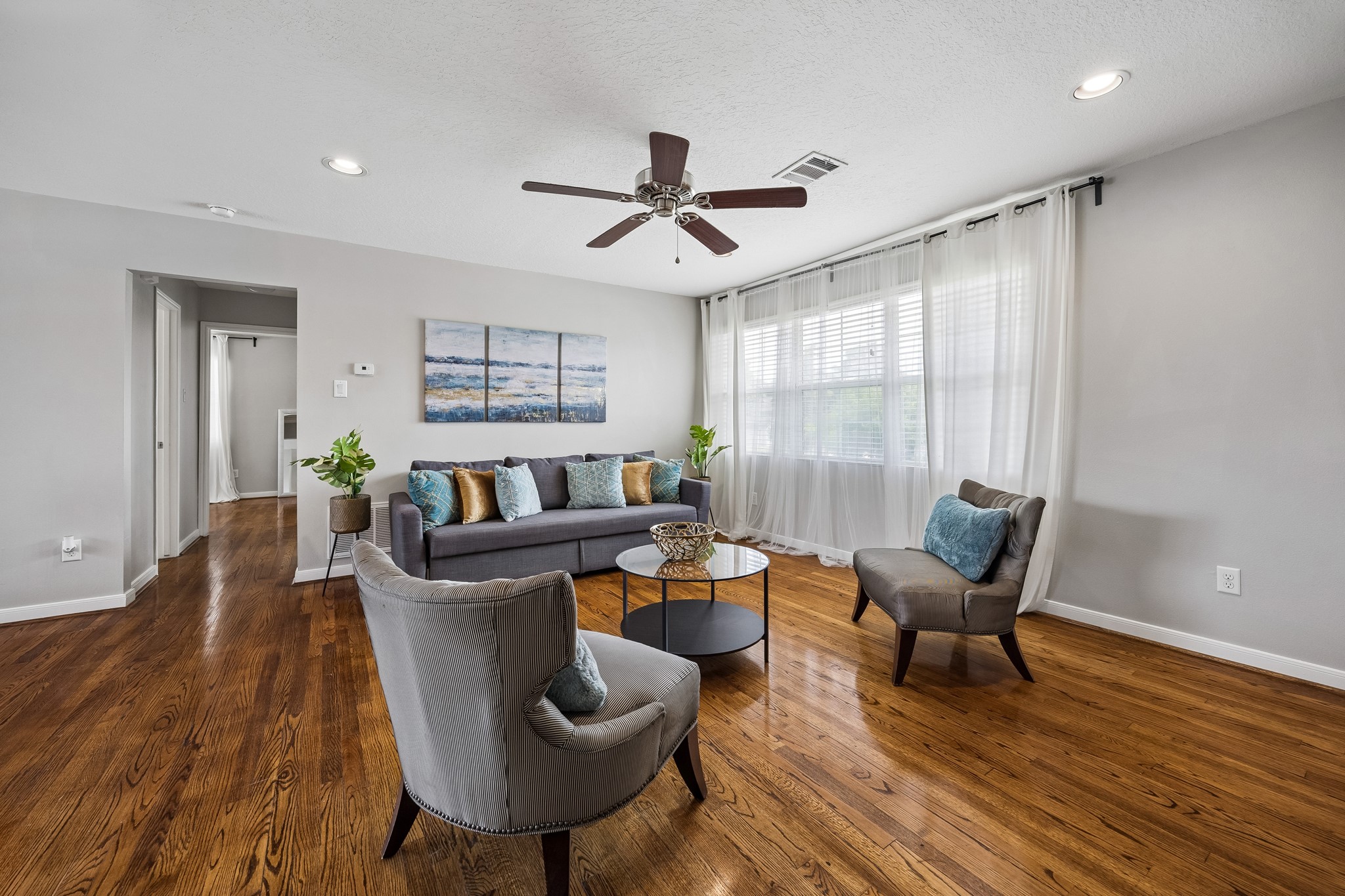 3237 Rosedale Street, Unit 4 Houston, TX 77004 - Photo 2 of 17 a living room with furniture and a wooden floor